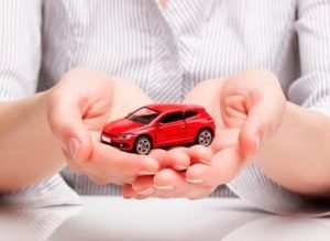 Hands Holding Red Car